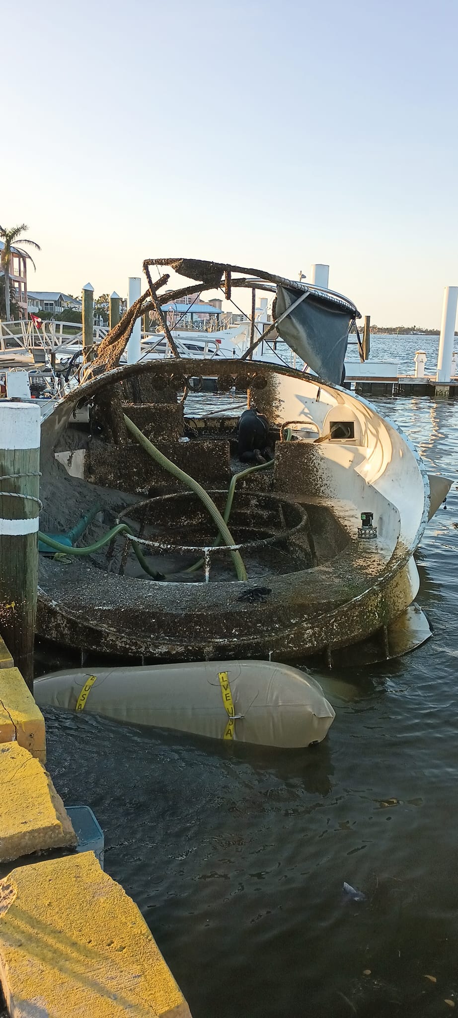 Damaged cruiser with hoses and flotation equipment
