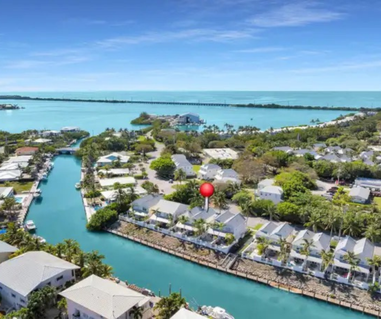 Waterfront homes in Marathon Florida with boats docked nearby canal