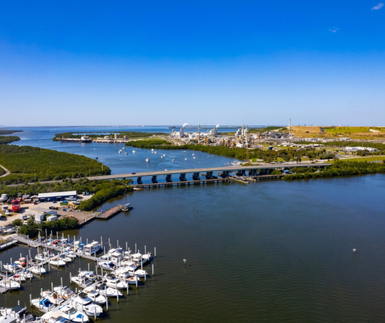 Private boats moored at marina slips in Gibsonton Florida.