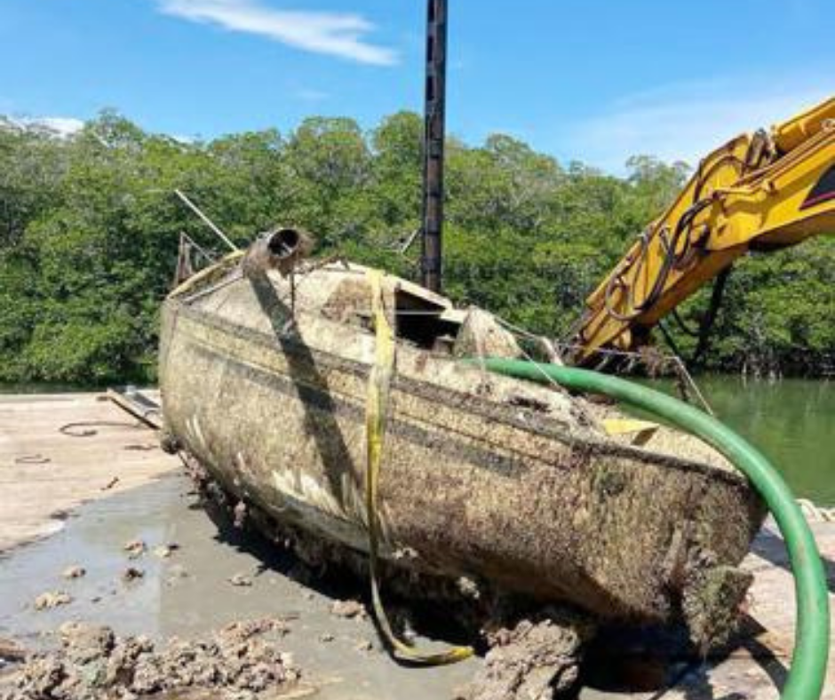 Broken boat stranded on land awaiting salvage in Islamorada Florida