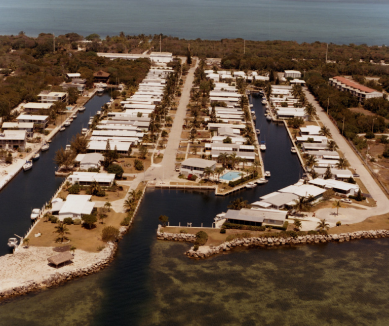 Traditional Florida Keys dock surrounded by calm blue water.