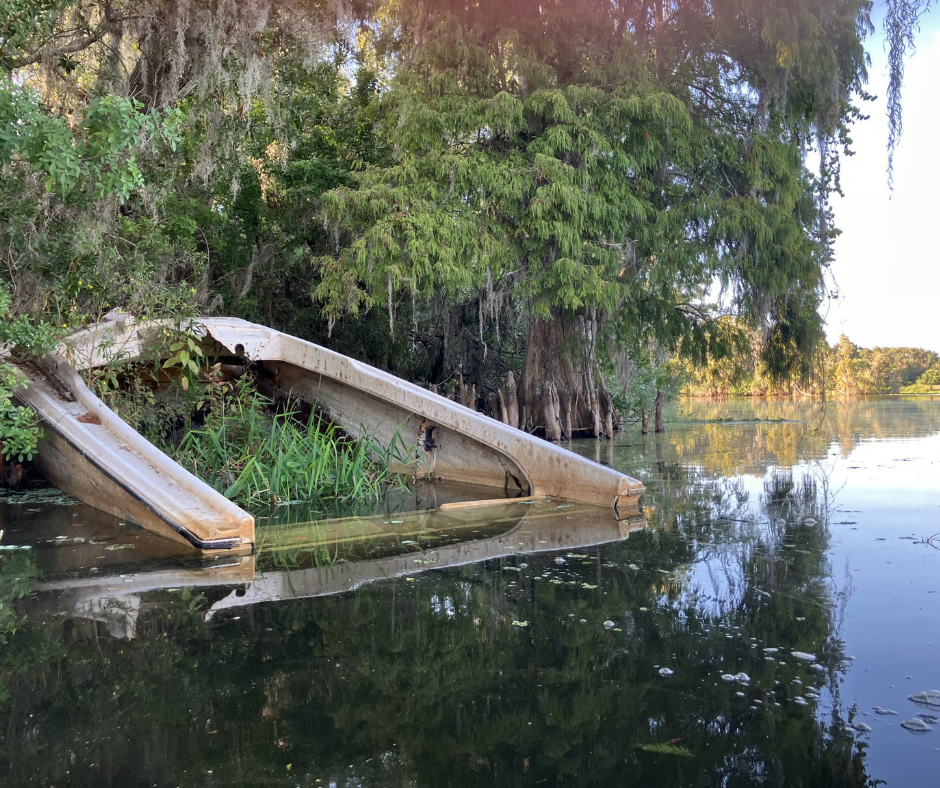 Sunken boat partially submerged in Tampa waters